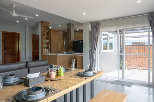 Modern open-plan dining area and kitchen with natural light