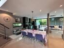 Open-plan living space with kitchen, dining, and living areas