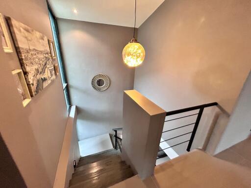 Modern staircase with a hanging light fixture