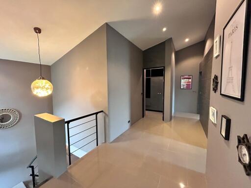 Modern hallway with stylish lighting and artwork