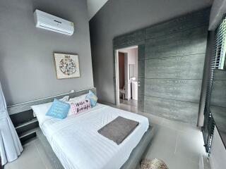 Modern bedroom with air conditioning and bathroom access