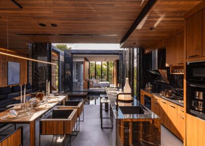 Modern kitchen with wooden cabinets and black marble countertops