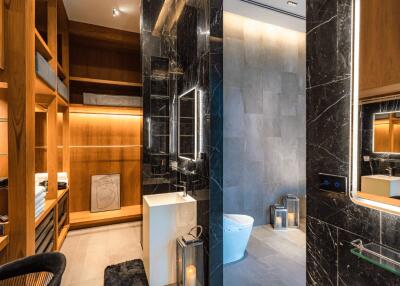 Modern bathroom with a sleek design and wooden storage shelves