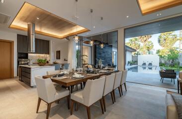 Modern dining room with large table and pool view