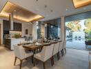 Modern dining room with large table and pool view