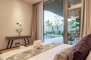 Modern bedroom with pool view