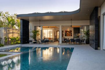 luxurious outdoor living and dining area with pool