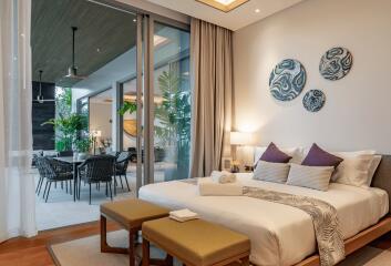 Modern bedroom with large glass doors opening to a terrace