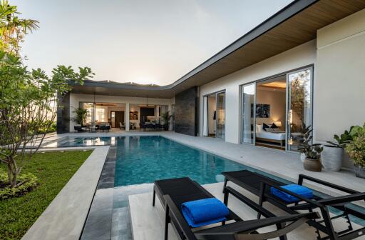 Modern house with swimming pool and lounging area