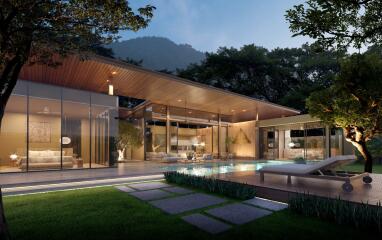 Modern house with glass walls and outdoor pool at twilight