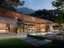 Modern house with glass walls and outdoor pool at twilight