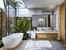 Modern bathroom with large freestanding bathtub, double sink vanity, and indoor plants