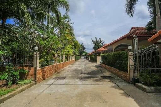 Long driveway leading to houses