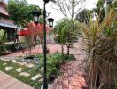 Beautifully maintained backyard garden with paved pathways and plants