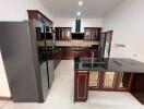 Modern kitchen with dark cabinetry and sleek appliances