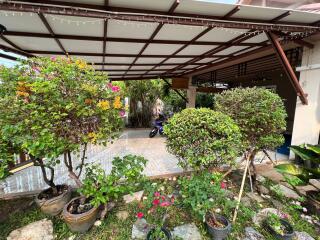 Outdoor area with garden and carport