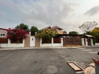 Exterior view of a residential house with a garden