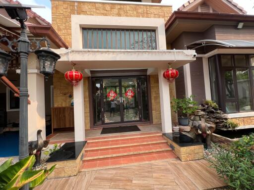 Front entrance of a house decorated with red lanterns