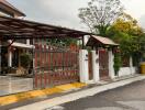 Front view of the exterior gate and entrance of a house