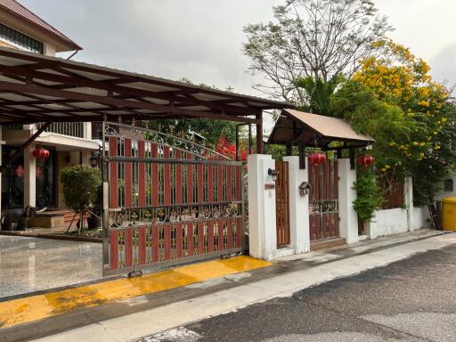 Front view of the exterior gate and entrance of a house