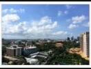 Skyline view of city with multiple buildings and greenery