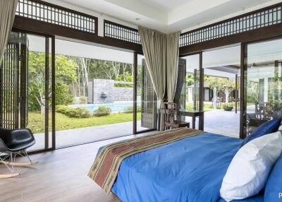spacious bedroom with pool view
