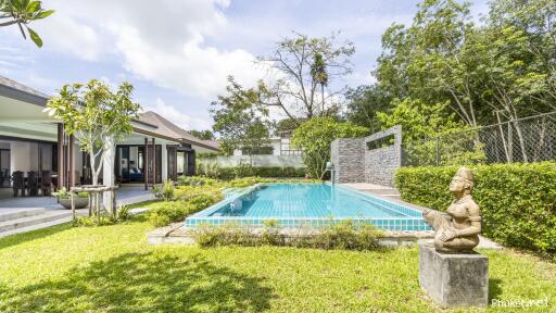Outdoor area with swimming pool and greenery