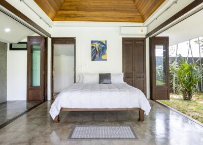 Spacious bedroom with outdoor access and modern design