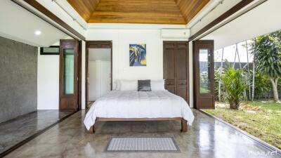 Spacious bedroom with outdoor access and modern design