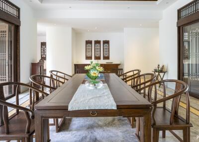 Spacious dining room with wooden furniture and modern decor