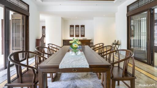 Spacious dining room with wooden furniture and modern decor