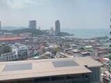 Skyline view from a high-rise building overlooking a city and the sea