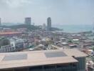 Skyline view from a high-rise building overlooking a city and the sea