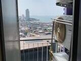 View from balcony with cityscape and sea