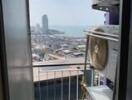 View from balcony with cityscape and sea