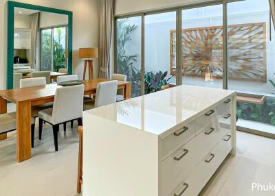 Modern kitchen and dining area with large island and contemporary decor