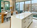 Modern kitchen and dining area with large island and contemporary decor