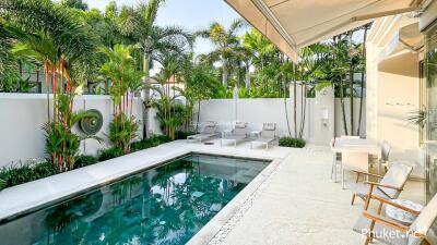 Modern outdoor area with swimming pool and seating arrangements