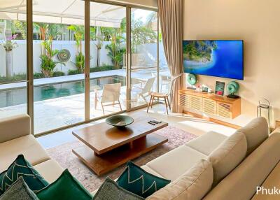 Bright living room with modern decor and pool view