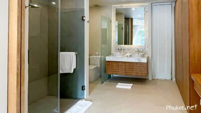 Modern bathroom with glass shower and double sink