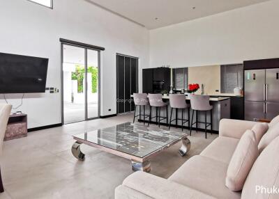 Modern living room with open kitchen and dining area