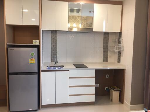 Modern kitchen with white cabinetry and appliances