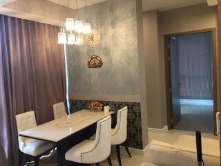 Dining room with chandelier and wall decorations