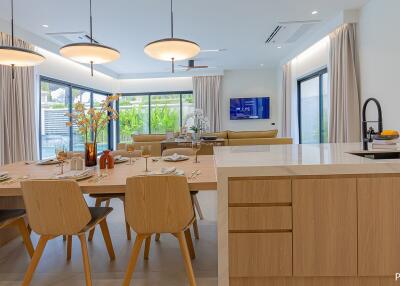 Modern kitchen and dining area with wooden furniture