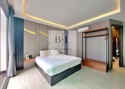 Spacious modern bedroom with ambient lighting