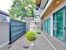 Modern building exterior with walkway and greenery