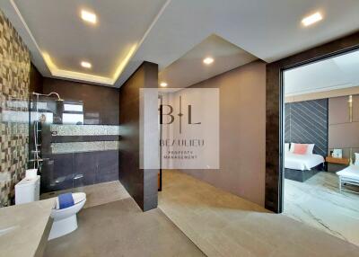 Modern bathroom with tiled walls and walk-in shower