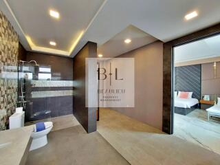 Modern bathroom with tiled walls and walk-in shower