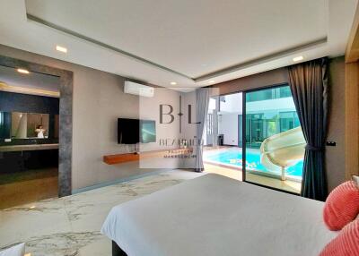 Spacious bedroom with a view of the pool