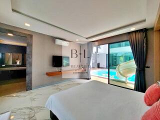 Spacious bedroom with a view of the pool